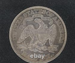 1877 Demi-dollar assis de liberté AU tonifié